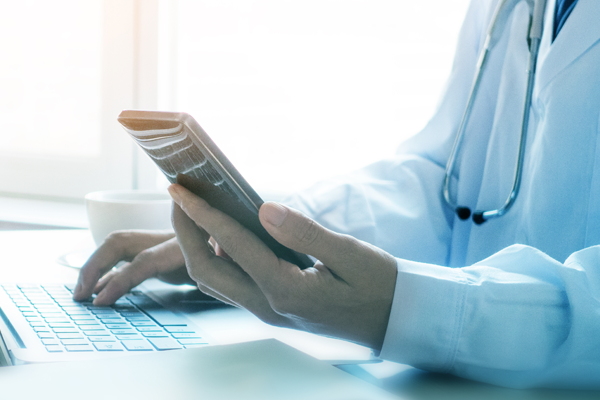 Doctor with a computer