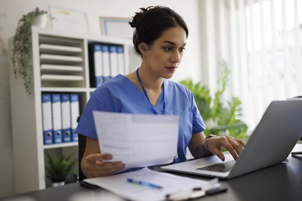 Doctor reviewing files