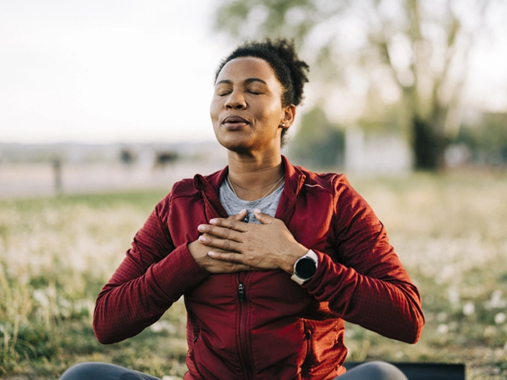 A woman taking a deep breath