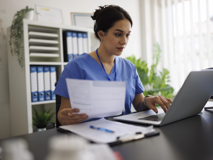 Doctor reviewing files