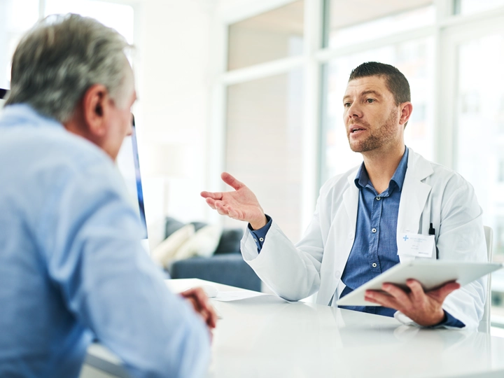A doctor talking to a patient