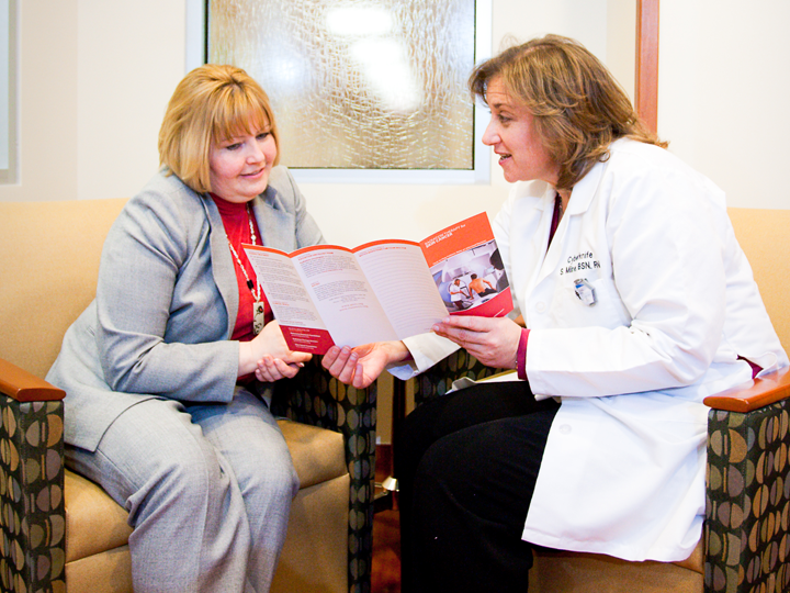 Patient looking at brochure.