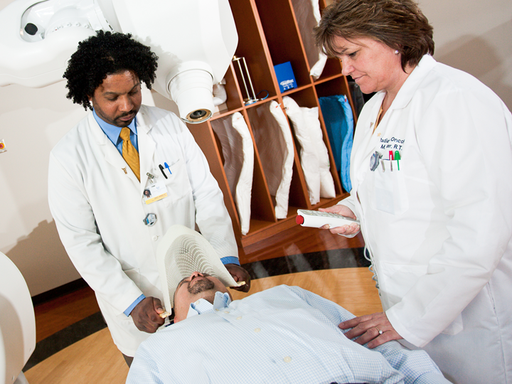 Doctors helping patient