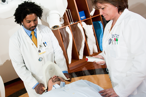 Doctor helping patient.