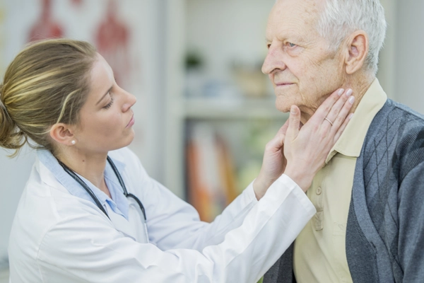 Doctor checking lymph nodes