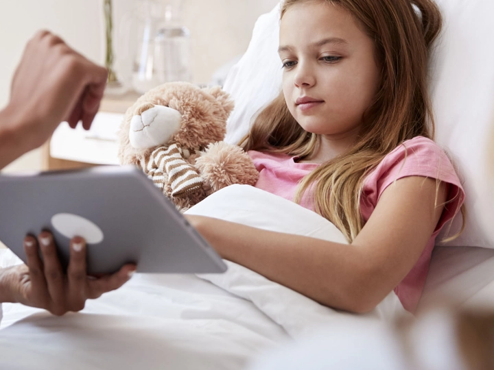 A child in a hospital bed