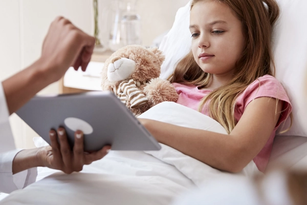 A child in a hospital bed