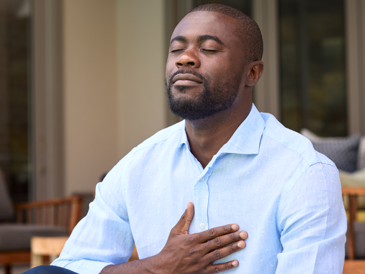 Man taking deep breath