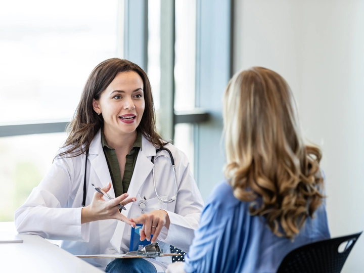 A female doctor giving instructions to a female patient
