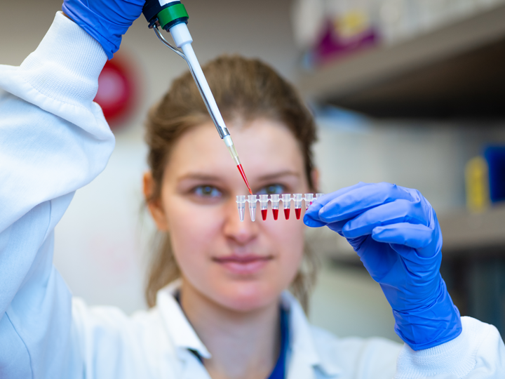 Scientist with dropper