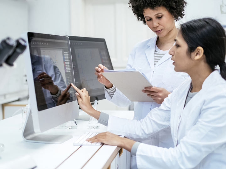 Doctors looking at a computer