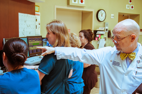 Nurses helping a patient