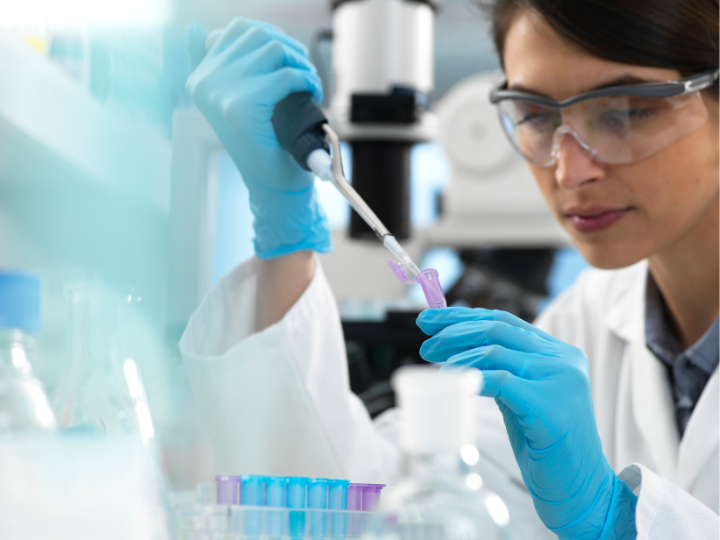 Doctor holding dropper