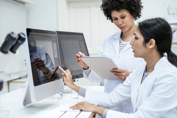 Doctors looking at a computer