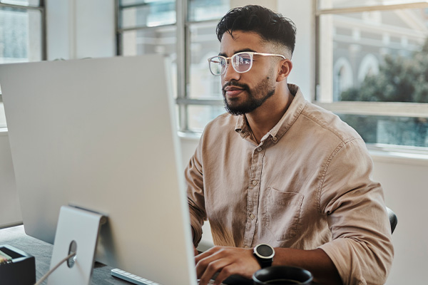 Man looking at a computer