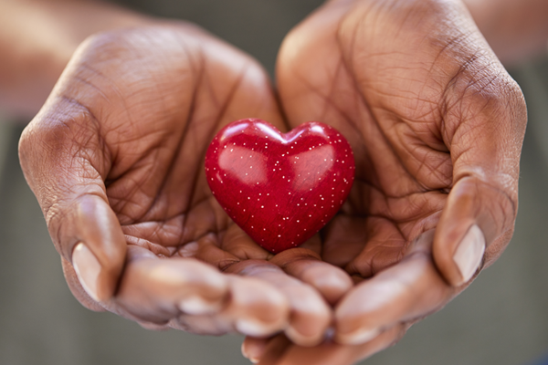 Hands holding a heart