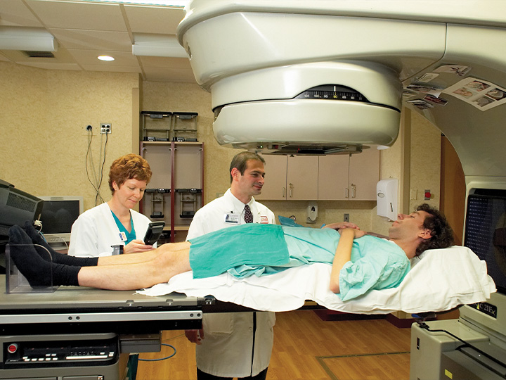 Doctors and patient on a linac
