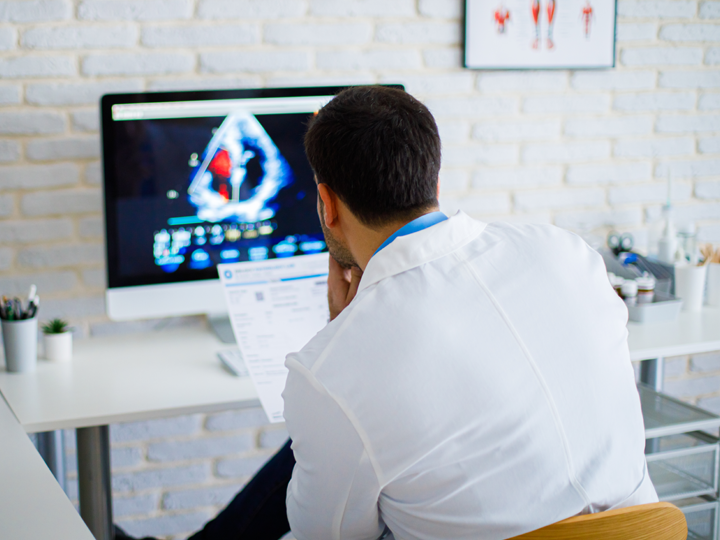 Doctor looking at a computer