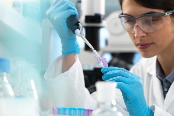 Doctor holding dropper